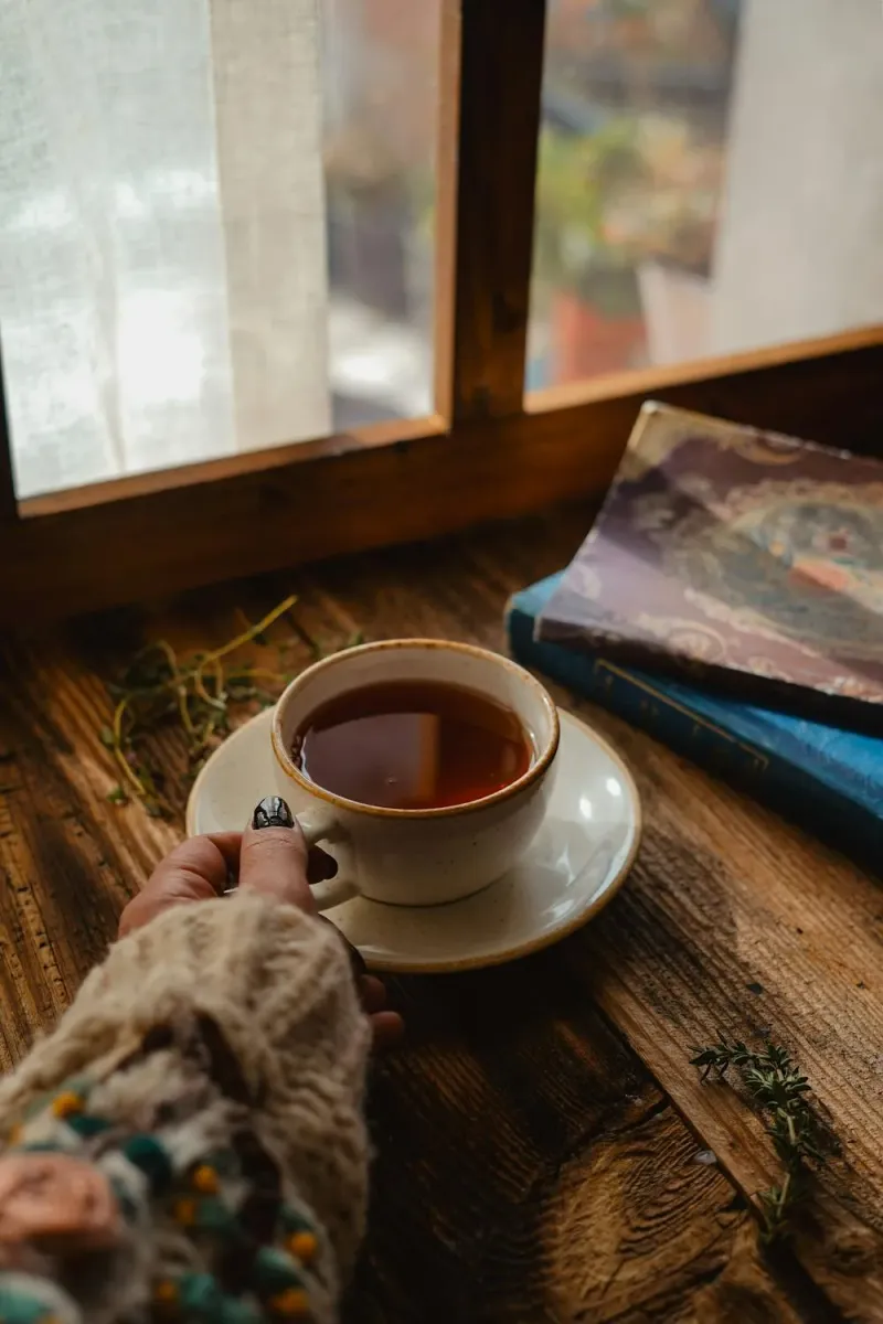 Warm cup held in hands, a quiet moment of reflection